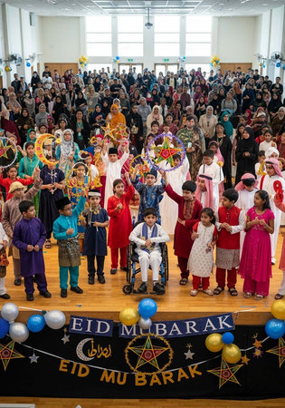 Large crowd of people in colorful traditional clothing gathered for Eid Mubarak celebration