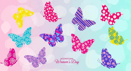 A colorful illustration of butterflies celebrating International Women's Day with vibrant patterns and pastel backgroundの写真素材