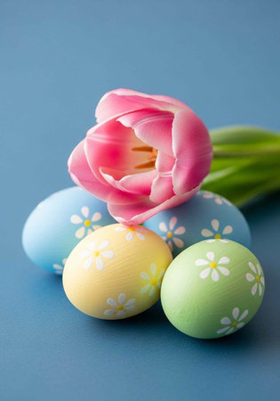 A pink tulip flower surrounded by colorful Easter eggs with floral patterns on a blue background
