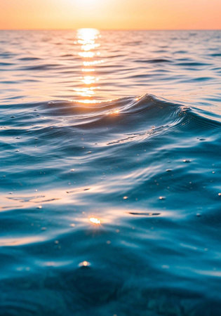 A serene ocean wave at sunset with warm sunlight reflecting on the water surface calmly