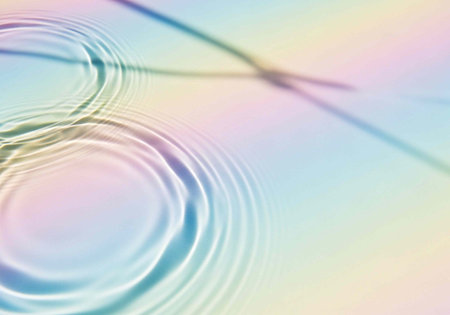 A serene and peaceful abstract image of ripples in water with a pastel color background