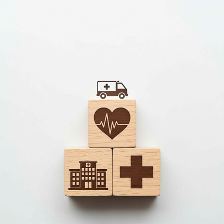 Medical icons on wooden blocks representing healthcare and emergency services