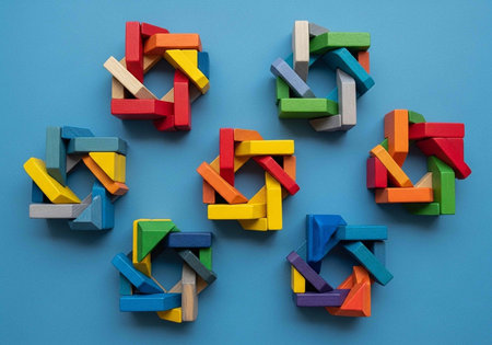 A collection of colorful wooden puzzle pieces arranged in a circular pattern on a blue background