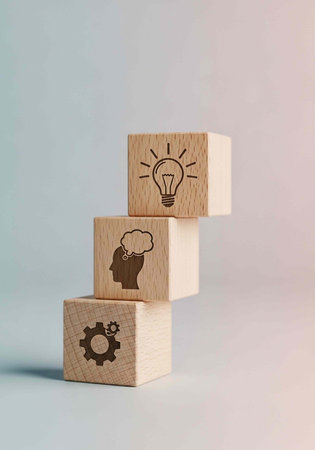Three wooden blocks stacked with creative thinking symbols on a pastel background