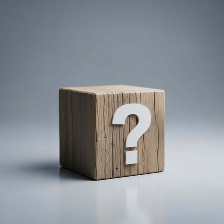 A wooden block with a question mark on it sits on a gray surface