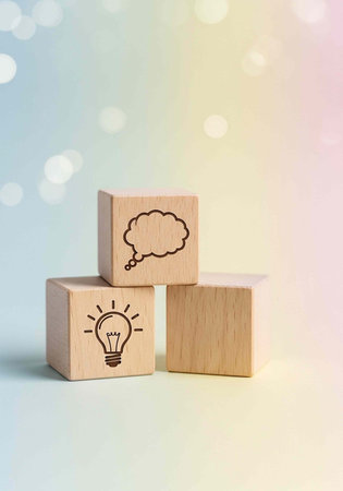 Three wooden blocks with icons on a colorful background with white bokeh lights shining