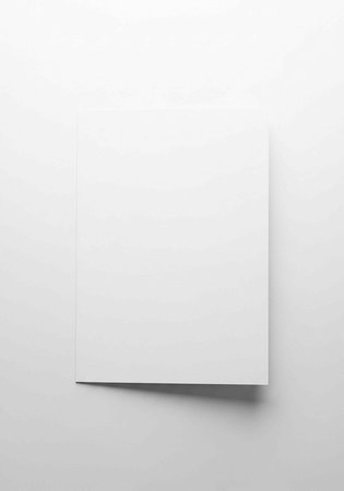 A white square card with a slight shadow on a gray surface