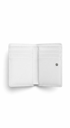 Open white leather wallet showing card slots and cash compartment on a plain background