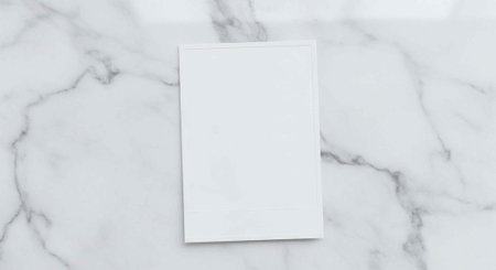 A blank white card on a marble surface with gray veins