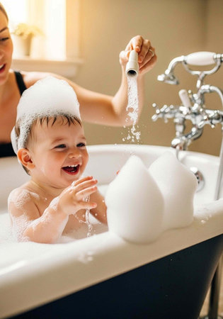 A mother and her young child enjoying a fun bath time together in a clean bathroom