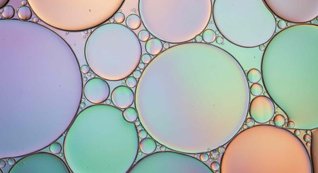 Pastel-colored oil bubbles of various sizes, showcasing iridescent sheen and rounded shapes