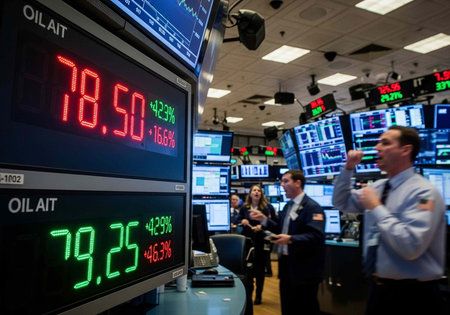 Business professionals standing near computer monitors and large screens showing stock prices and...