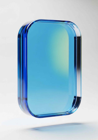 A shiny, rectangular object with rounded corners and a smooth, reflective surface appears to be suspended in air.の写真素材