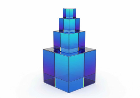 A stack of blue glass blocks in various sizes forming a tower on a plain white surface and backgroundの写真素材