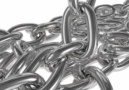 A tangle of silver metal chain links with smooth, reflective surfaces and detailed textures on a...