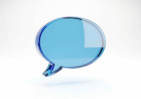 A single blue speech bubble with a glossy finish and reflective surface is centered on a plain white backgroundの写真素材