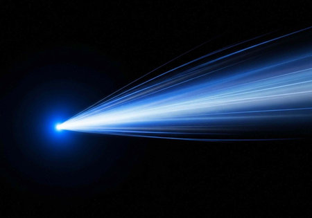 A bright blue light beam shoots out into the dark space with vibrant streaks of light