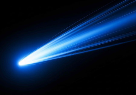 A bright blue streak of light shoots through the dark space with vibrant energy and motion