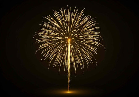 A vibrant firework explodes in the night sky with bright yellow sparks and a warm glow