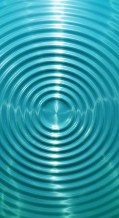 A close-up view of ripples in calm blue water with sunlight reflecting on the surface