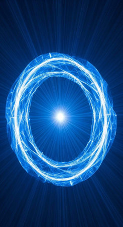 A glowing blue ring with a bright light at its center radiates energy in a dark backgroundの写真素材