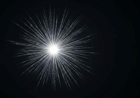 A bright white light shines in the darkness with radiant lines emanating from it.