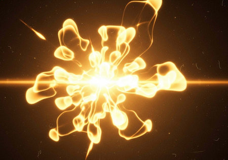 A vibrant and dynamic explosion of golden light against a dark backgroundの写真素材