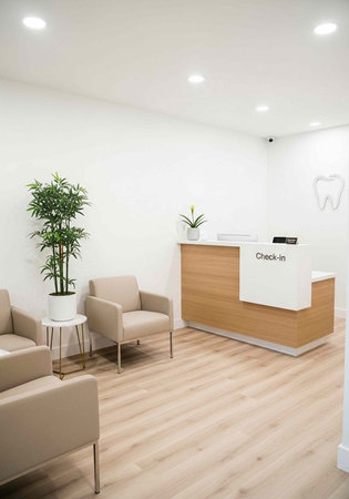 A modern dental office with a clean and minimalist reception area featuring a check-in desk and...