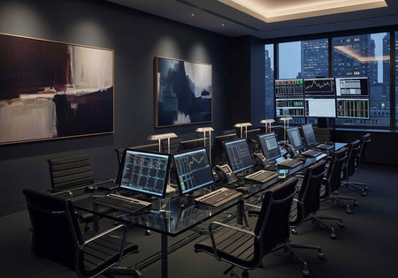 A modern office with multiple computer workstations and a city view at dusk, featuring a sleek glass...