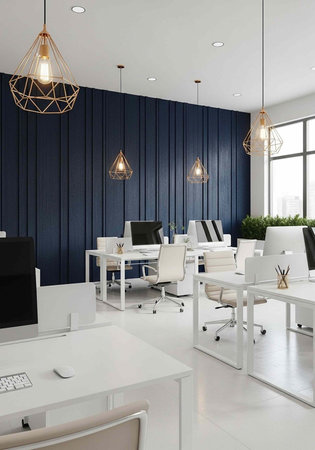 A modern office space with white desks and chairs, featuring a blue accent wall and large windows