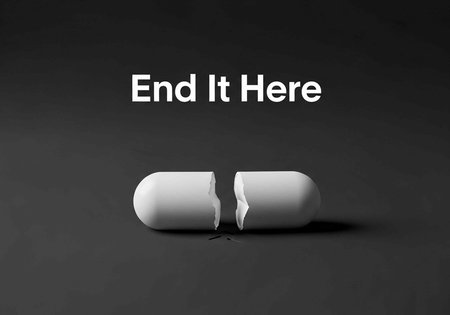 A broken white pill on a dark background with the words End It Here above it