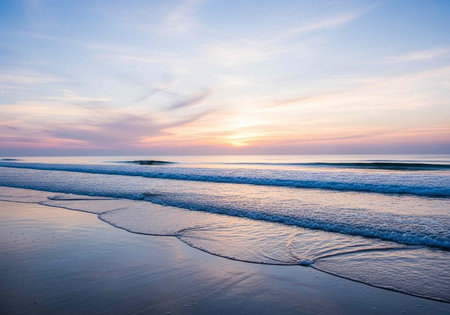 A serene beach scene at sunset with gentle waves and a peaceful atmosphere
