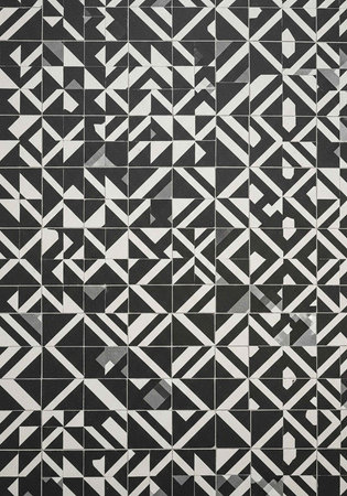 Monochromatic tile pattern with geometric shapes in black, white, and gray hues
