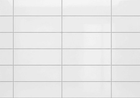 A serene landscape of a mountain range at sunset with a peaceful ocean in the foregroundの写真素材