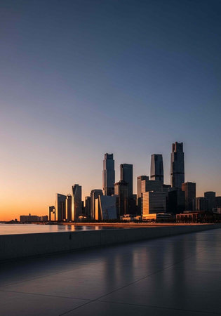 A serene city skyline at sunset with modern skyscrapers reflecting on the water