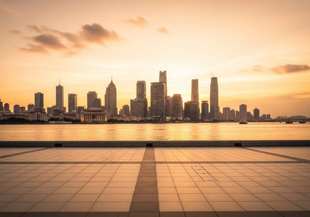 A serene city skyline at sunset with a calm waterfront and modern architecture in the background