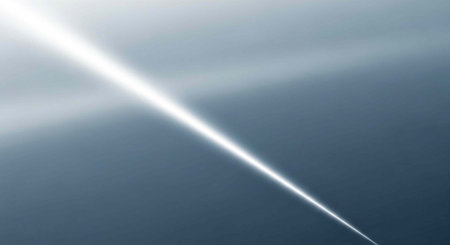A bright beam of light shining through a clear blue sky with a subtle gradient effect