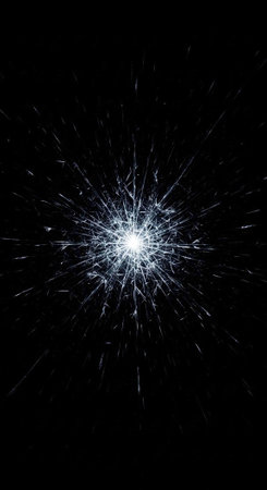 A bright white light explodes in a dark space with vibrant streaks of light radiating outward