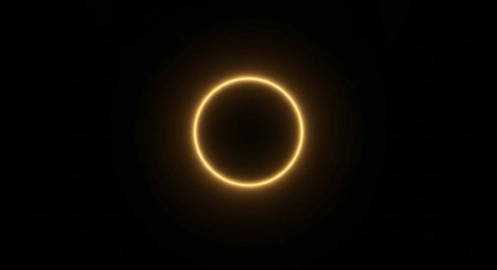 A stunning solar eclipse with a bright yellow ring against a dark background