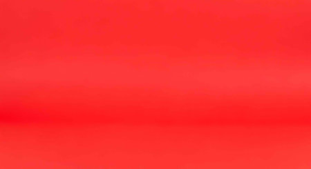 A vibrant red background with a smooth gradient effect