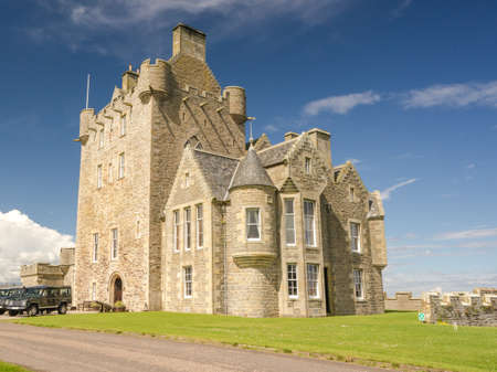 luxuary hotel of Ackergill Tower at Sinclair Bay in the Scottish Highlands. Beautiful green lawn at an historic old british mansion at Wick, Scotland. Noble residenceのeditorial素材