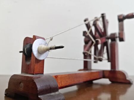 Mahatma Gandhi's Spinning Wheel also called charkha front view with focus arranged back to front. A beautiful abstract representative commemoration of Mohandas Karamchand Gandhi, Father of The nation, India.の写真素材