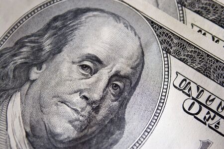 A closeup of the new 100 dollar bill picturing Benjamin Franklin.  It's all about the Benjamins.
