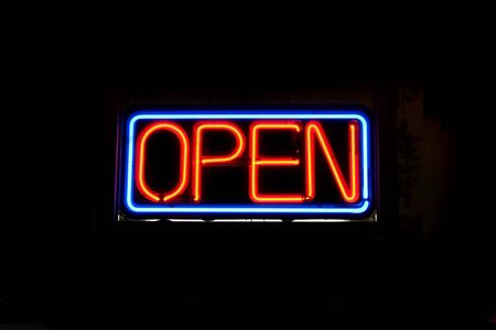 A neon OPEN sign commonly seen in businesses.の写真素材