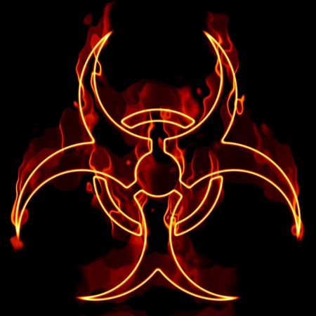 A biohazard symbol in flames isolated over a black background.の写真素材