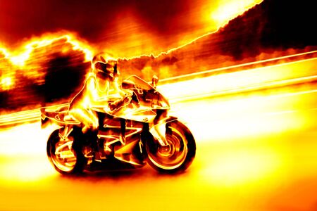 A woman in action driving a motorcycle at highway speeds with a fiery effect.の写真素材