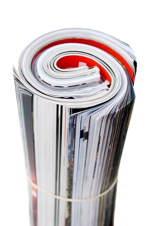 Rolled up magazines isolated over white. Shallow depth of field.  の写真素材