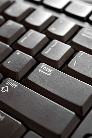 Closeup of the keys on a black colored computer keyboard.  Shallow depth of field.の写真素材