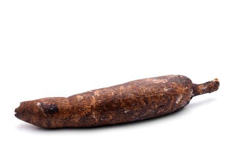 A large yuca root isolated over white.  Yuca plant is also known as cassaba or cassada or locally as mandioca aipim or macaxeira.の写真素材