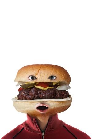 A man with a hamburger as a  head.  They say you are what you eat!  の写真素材